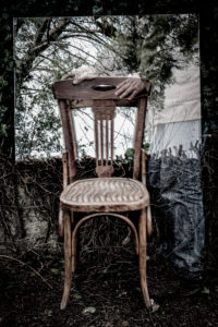 Poetic image of reflections in a garden and forest with a wooden chair in an atmosphere of a dream Poetic image of reflections in a garden and forest with a wooden chair in an atmosphere of a dream